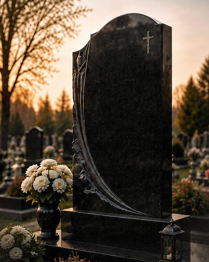 Гранітний памʼятник, граніт габро — чорний · фігурне різьблення